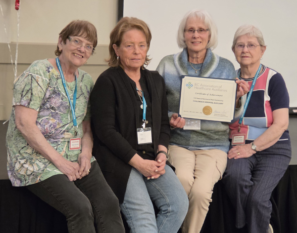 Vernon conference being presented with a 115 year certificate